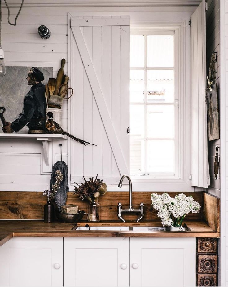 White wood kitchen with brown wood countertops