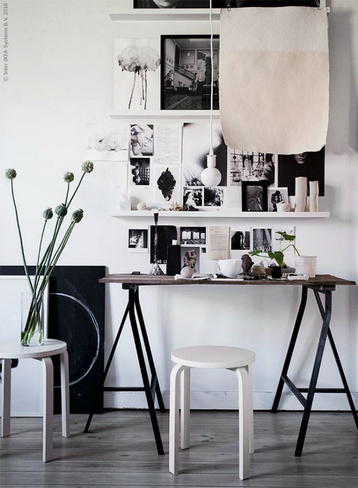 minimalist desk with sleek black and white gallery wall
