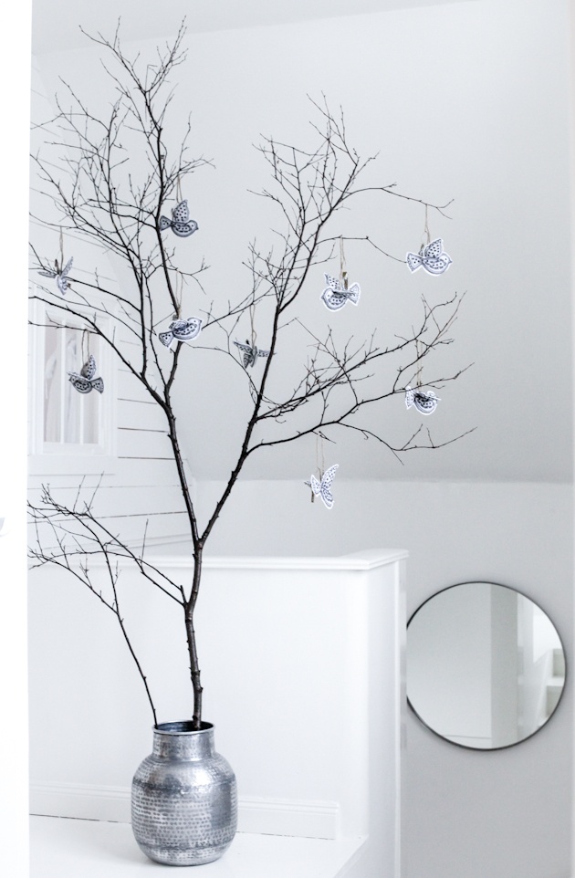 Branches in a sliver pot with silver ornaments
