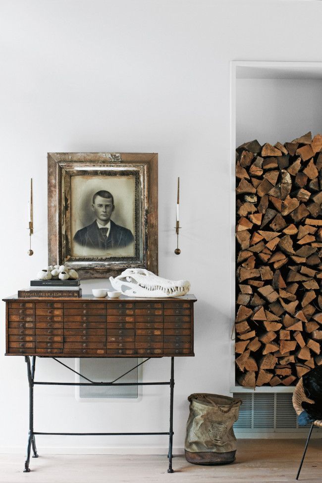 Antique card catalog with vintage portrait and pile of chopped wood