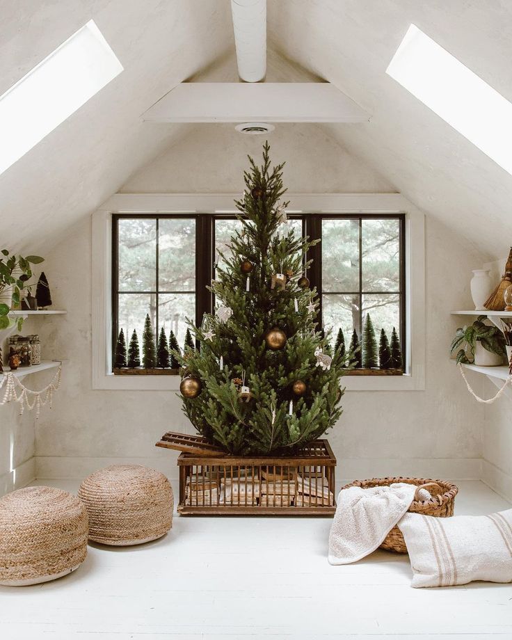 Simple natural Christmas tree in white Scandinavian style room with rattan poufs and natural linen pillows