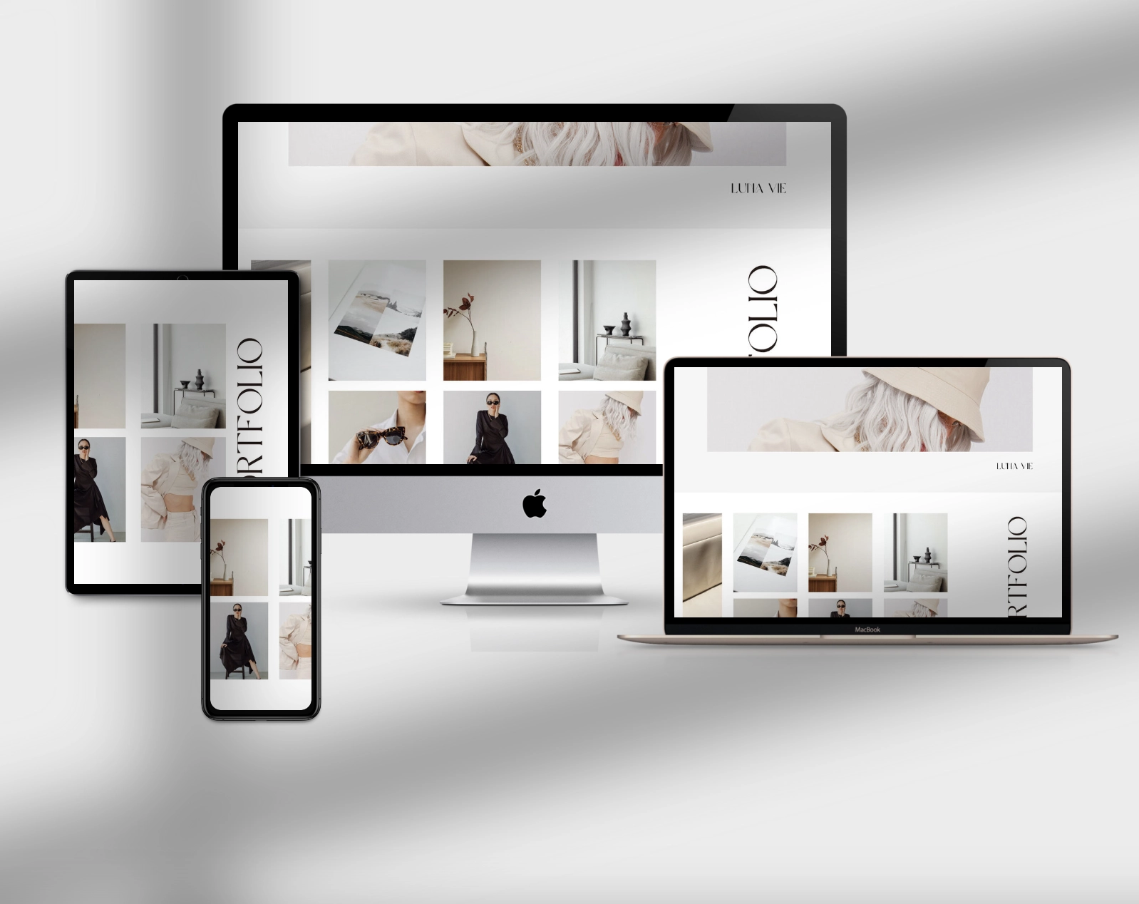 Multi device mockup of feminine website portfolio on white background with shadows