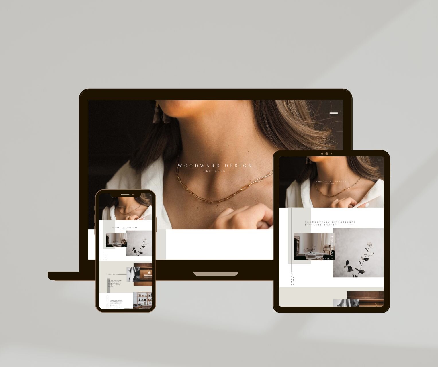Three screen mockup of feminine Showit template for interior designers