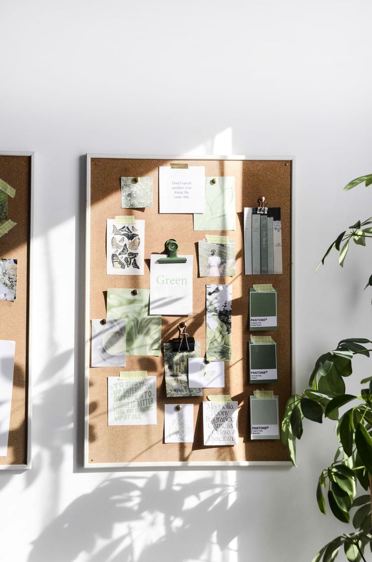 A cozy home office setup with a vintage vibe, featuring a glass-top desk supported by wooden sawhorses, a rustic chair, and a large industrial filing cabinet. The desk is adorned with a modern iMac, a black adjustable desk lamp, and various small decor items. A portrait in a gold frame hangs on the wall, adding a touch of character to the workspace.