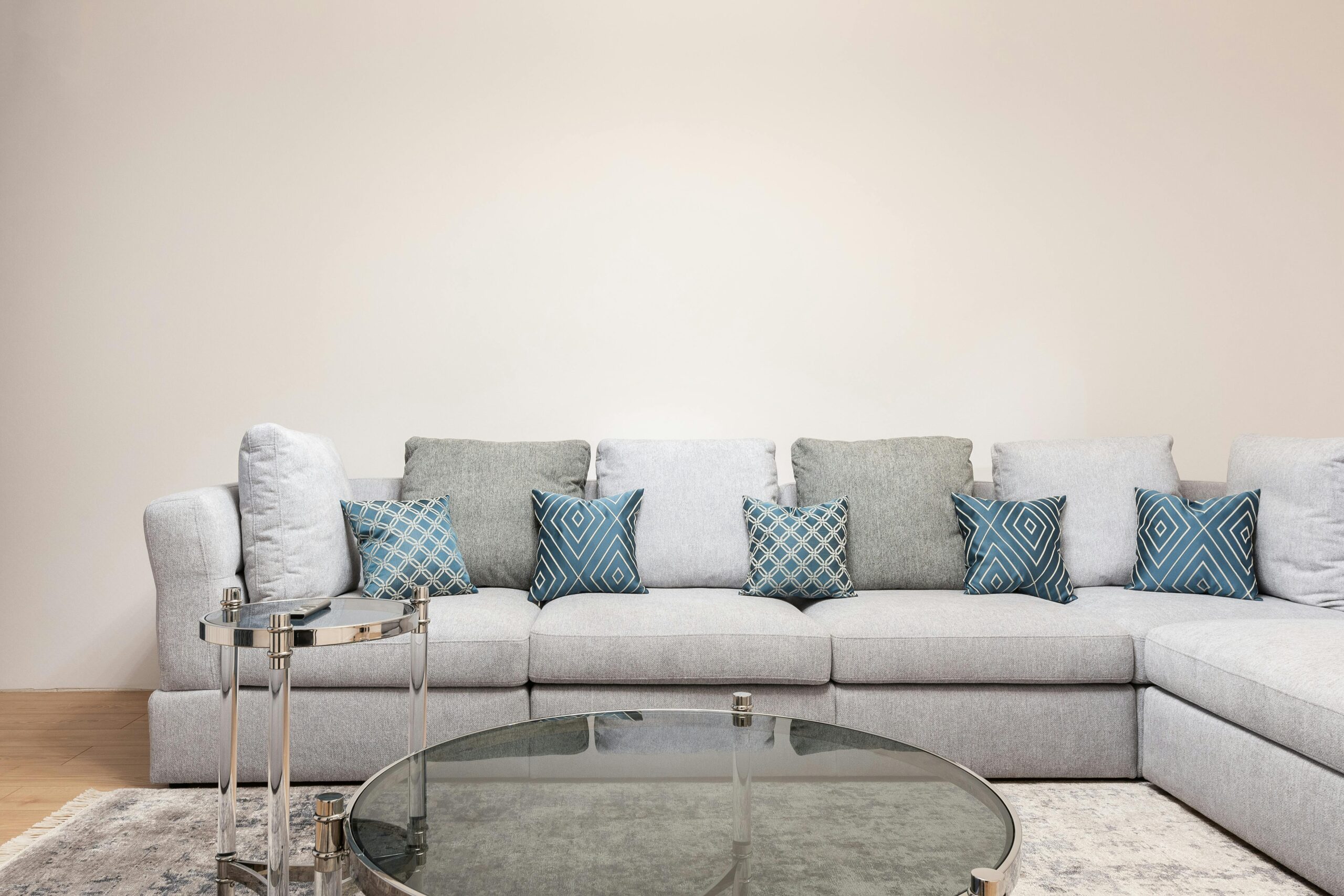 Neutral living room sofa with blue pillows