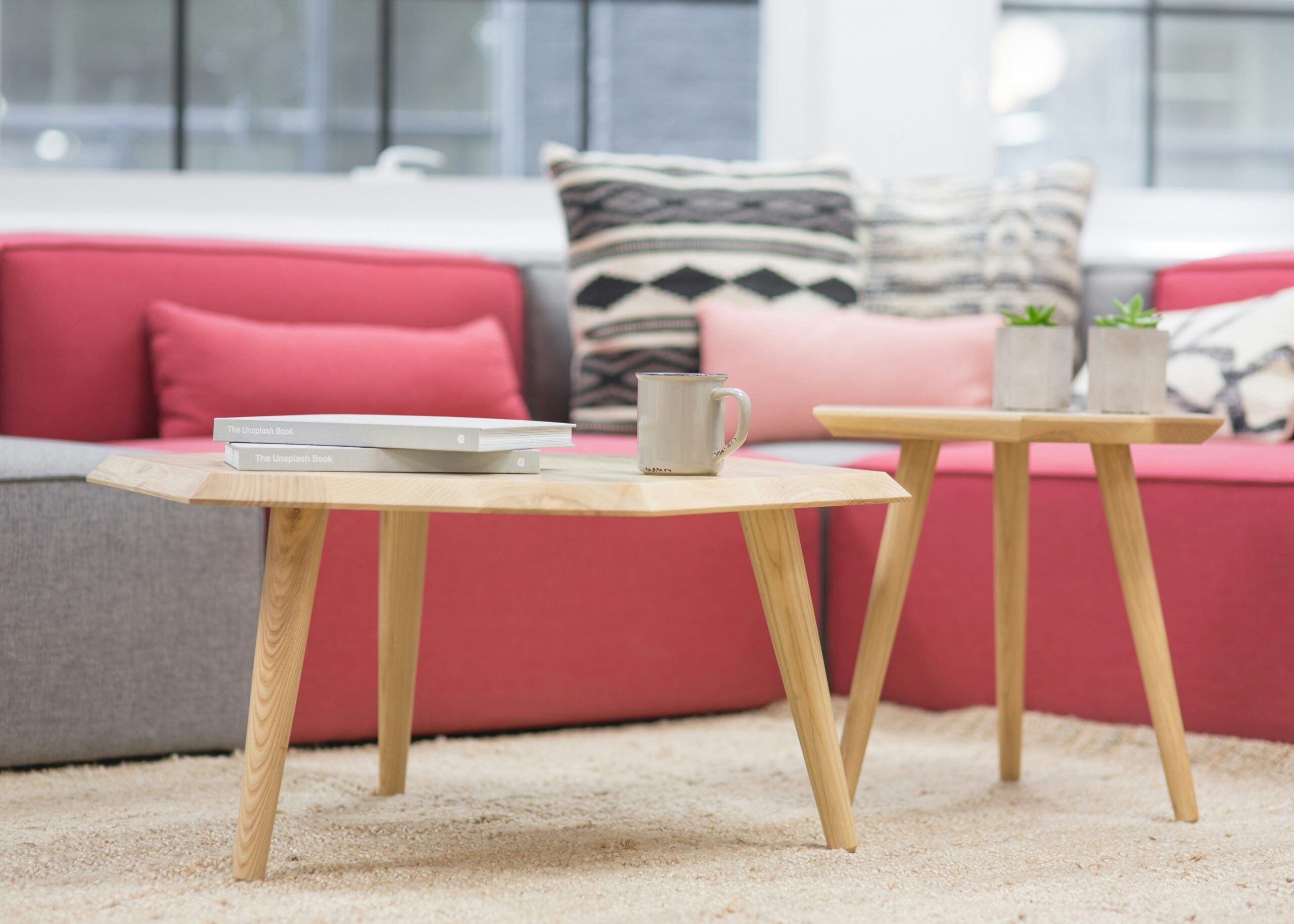 Pink sofa with boho pillows