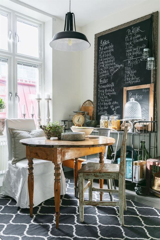 Rustic weathered cabinet with peeling paint and simple decor pieces, adding vintage charm without clutter.