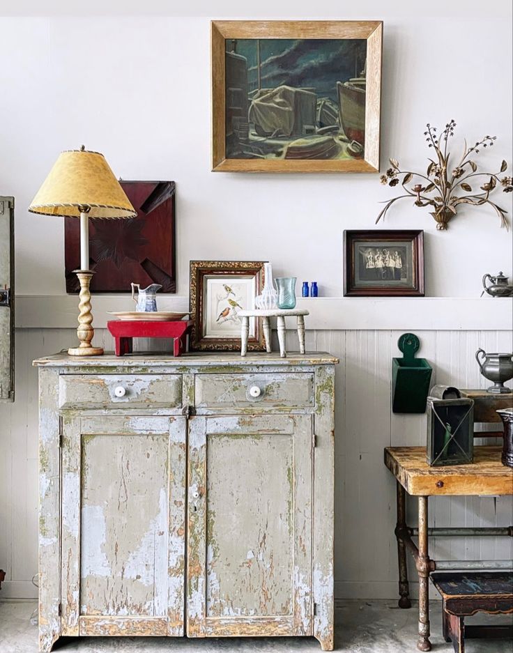 An image showing a large, statement piece of framed nostalgic art. The vintage map provides historical character and anchors the living room space with its impressive size and muted tones.