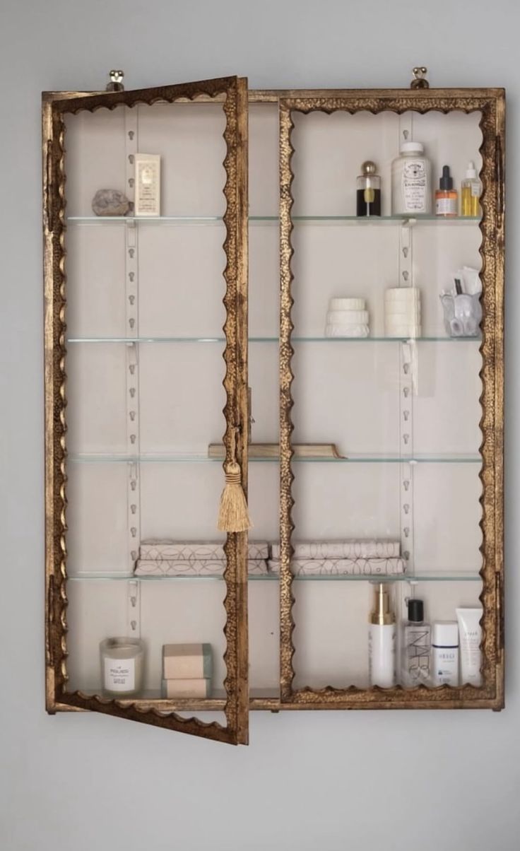 A vintage Louis XV-style wooden chest converted into a bathroom vanity, featuring an undermount sink, a thick honed marble countertop, and elegant curved legs.